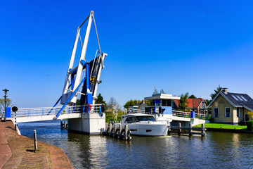 Woudsend, Netherlands, opened lifting bridge allows passage for ship