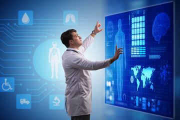 Doctor in telemedicine concept looking at screen