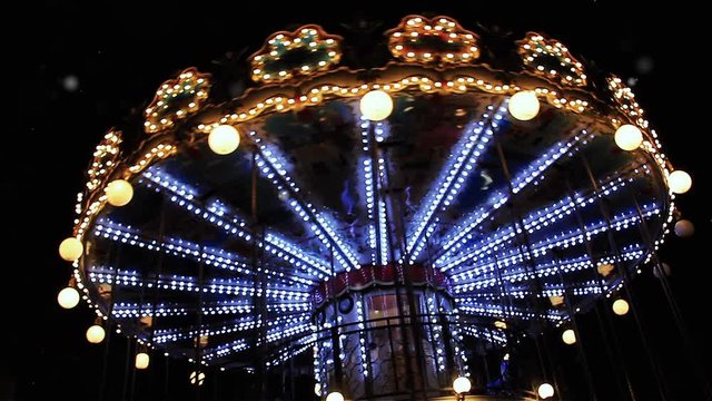 Carousel Below The Eiffel Tower At Twilight.