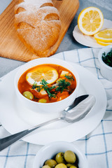 Solyanka a thick soup of vegetables and meat served with lemon and olives