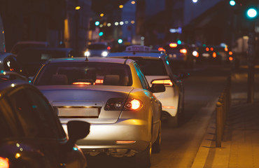 Cars traffic jam in the city by night