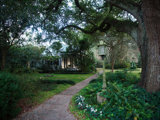 A house surrounded by vegetation at the Burden Museum & Gardens, located on the grounds of the LSU Rural Life Museum, Baton Rouge, Louisiana, USA.