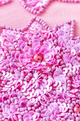 Obraz premium Fabric with sequins and sequins of bright colors. Fashion glitter fabric, sequins. Shiny surface