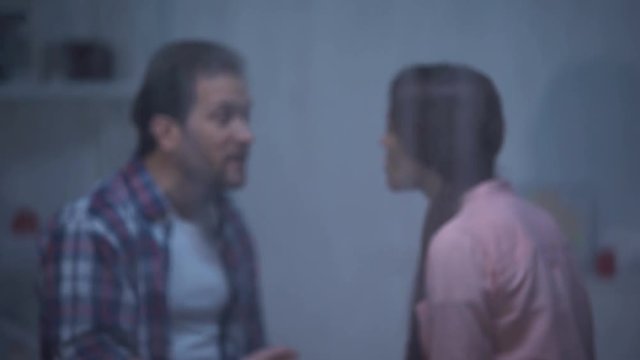 Nervous man abusing wife, misunderstanding in family, quarrel on rainy day