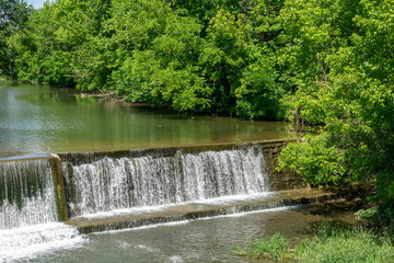 Amish Countryside with a Man Made Waterfall by a Mill