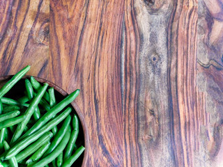 A bowl of green beans to the lower left