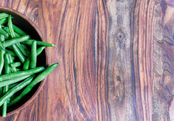 Bowl of green beans to the left of frame