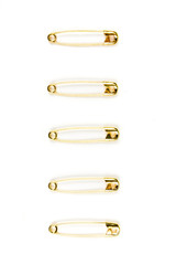 Five gold safety pins individually stacked on a white background