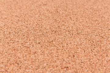 Plain brown empty cork board texture shallow depth of field