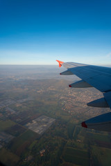 View from a plane of suburbs and fields of crops on the outskirts of the city of Bogotá. Colombia.
