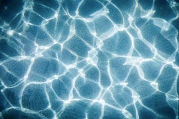 Abstract light movement in blue water