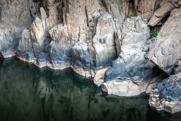 Fototapeta na wymiar Big rock under fall showing after water decrease