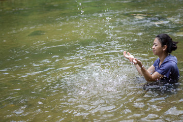 Asian women Play in the river