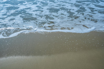 Soft beautiful ocean wave on sandy beach