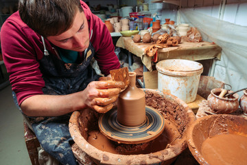 Potter at work. Workshop place.