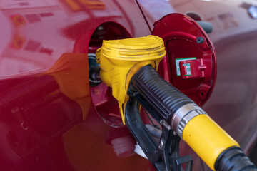 Gas or petrol nozzle for refuel vehicles, close up. Selective focus.