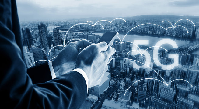 Internet networking and wireless technology. Businessman using mobile smart phone in the city, and 5G internet networking