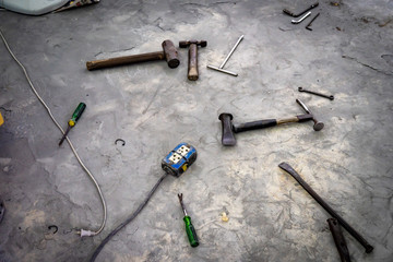 Auto Body Repair Tool , On cement floor , Disorderly