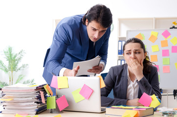 Two colleagues employees working in the office 