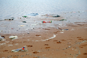 Fototapeta na wymiar Dirty beach in the morning, garbage pollution