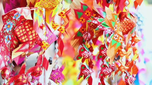 Footage Thai style palm leaf carp fish mobile handicraft activities in Songkran festival.