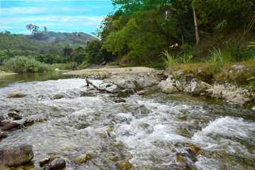 Canal landscape with water flowing through rocks