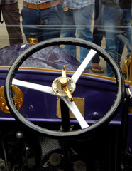 Fototapeta premium Close-up view of steering wheel of an antique car
