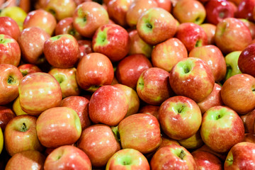 Pile of red apples in the market, close up