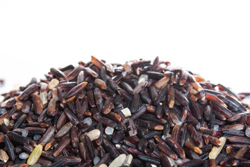 Brown rice, riceberry organic food  in white bowl Isolated and white background