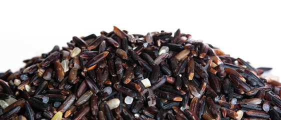 Brown rice, riceberry organic food  in white bowl Isolated and white background