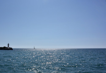 Fototapeta na wymiar View of the lighthouse of the sea port of Yalta