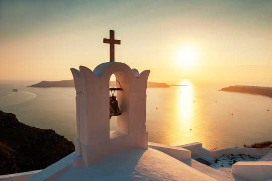 Traditional greek church at sunset on Santorini island, Greece
