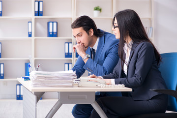 Two employees working in the office 