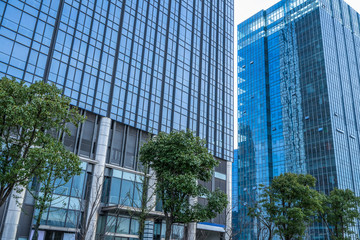 modern office building with green trees.