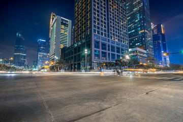 Fototapeta na wymiar empty concrete floor and cityscape at night