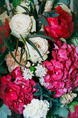 Flower background with roses, peonies, hortensias, carnations and other flowers.