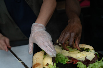 Hands of Two People Making Sandwiches - 264894210