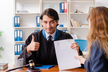 Young woman visiting male lawyer 