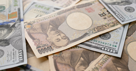 Japanese Yen and USD banknote
