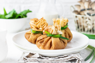 Pancake bags stuffed with with fried oyster mushrooms with spinach