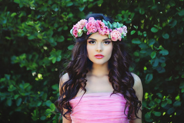 Summer woman in flowers crown outdoor portrait