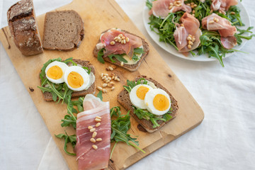 Antipasto platter cold meat with bread, eggs and salad