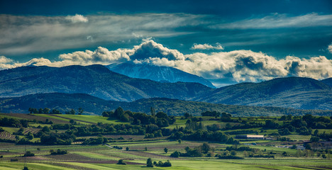 green valley and mountains landscape 
