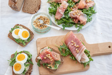 Antipasto platter cold meat with bread, eggs and salad