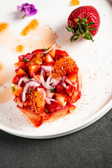 strawberry tartare with avocado and caviar