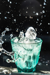 ice cubes flying in the glass