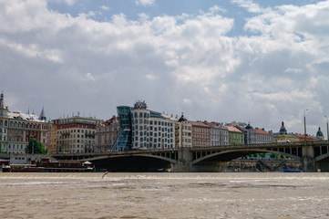 Obraz premium View to famous Dancing House in Prague from River Vltava, Czech Republic