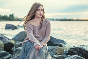Portrait of pretty young woman outdoors