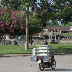 Street vendor in Vietnam, Hoi An, on the bike in March 2019