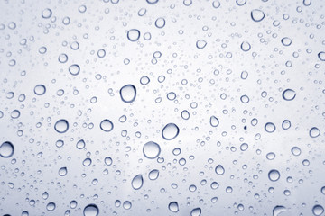 Water droplets texture on blue background